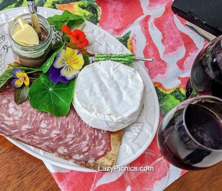 Wonderful platter of soft cheese, metwurst, pate and glass of red wine