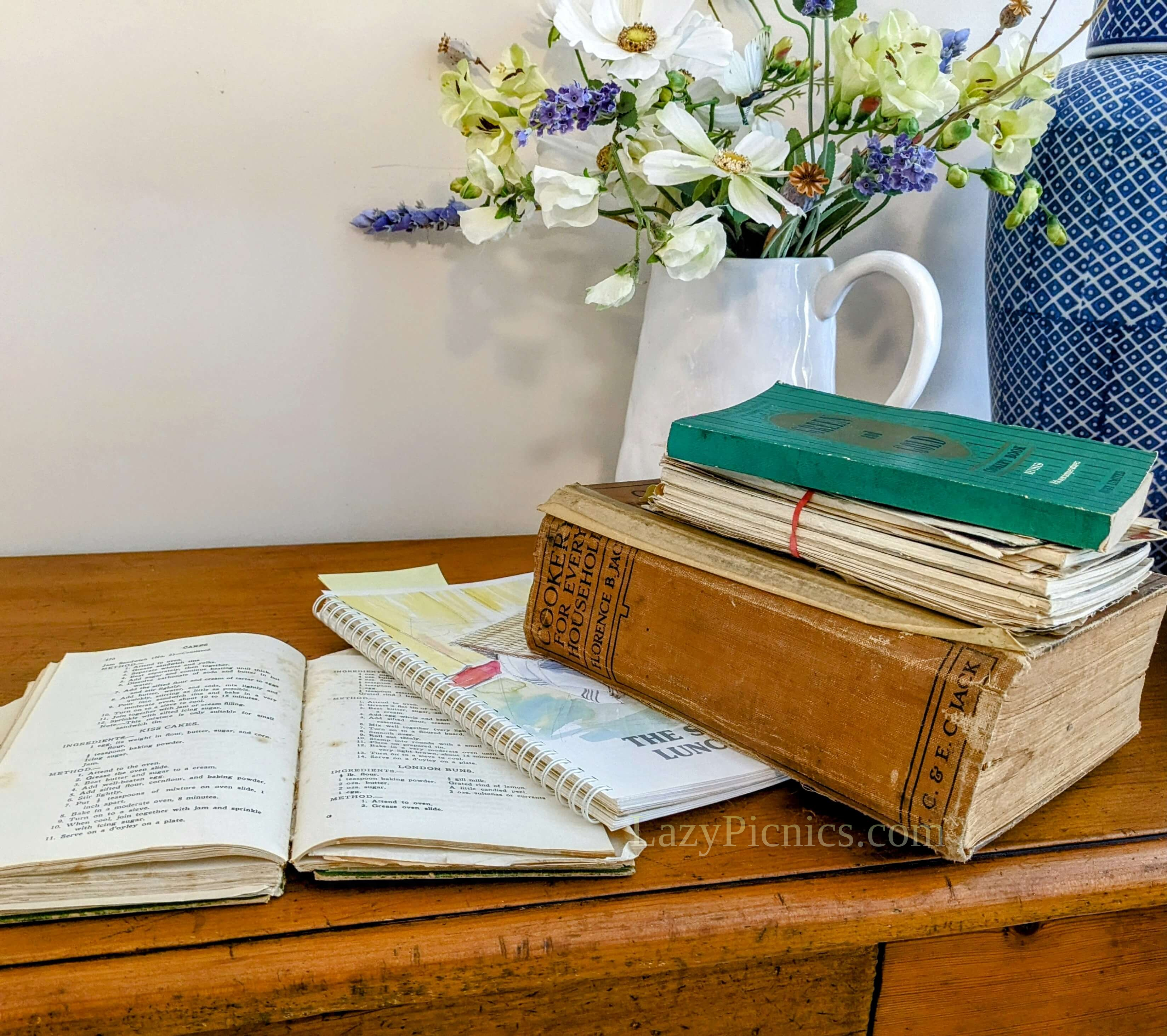 A pile of old book with recipes for a picnic A pile of old book with recipes for a picnic