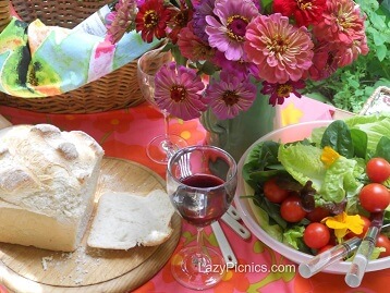 Picnic table with bread, food and wine...yum!