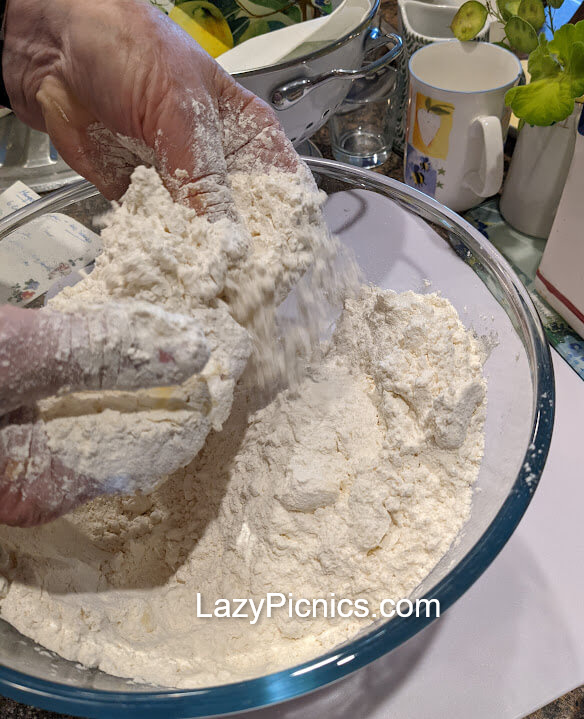 Showing how to rub butter into flours for shortbread